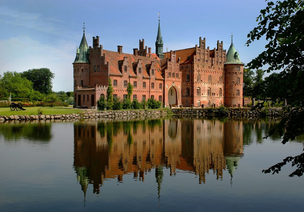 Egeskov Castle reflected in its moat