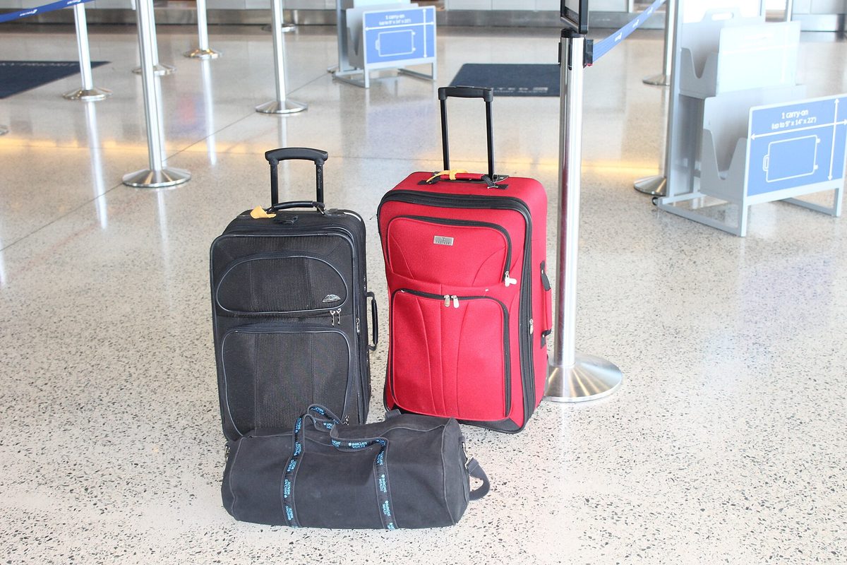 Suitcases at an airport check-in area